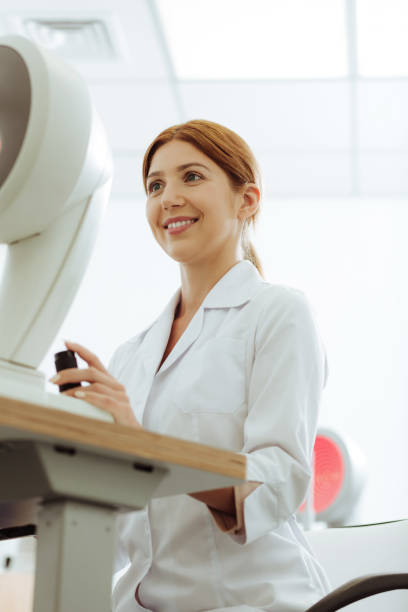 istock Red-haired young but promising eye doctor working 1161733470