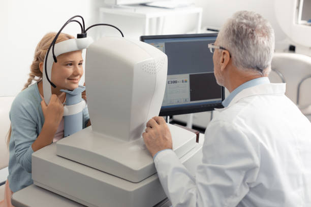 istock Blonde-haired cute girl smiling while visiting eye specialist 1161733505