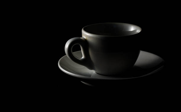 istock Isolated cup of coffee on black background 1161734079