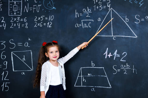 istock Schoolgirl in classroom at elementary school 1161734642