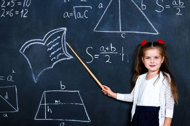istock Schoolgirl in classroom at elementary school 1161734822