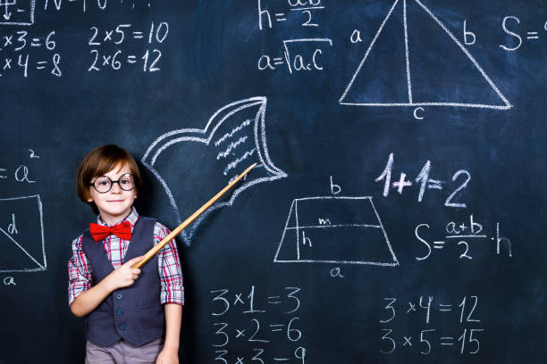 istock Schoolboy in classroom at school 1161734879