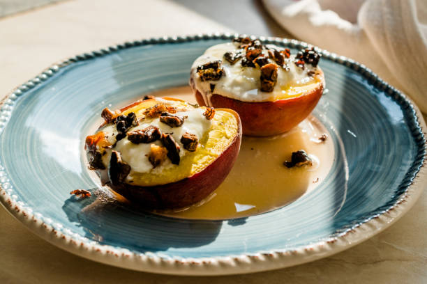 istock Baked Peaches with Greek Yogurt, Roasted Walnuts and Honey / Nectarines. 1161735074