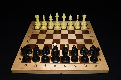 Chechered board with the chessmen like a leisure theme