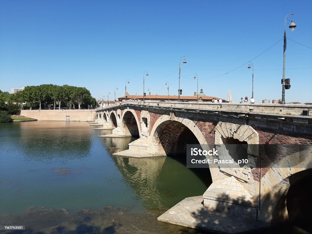 The garonne river and the Pont Neuf in Toulouse, France Toulouse, France - July 12, 2019: Photography that is showing the Garonne river and a bridge in the city of Toulouse Street Stock Photo