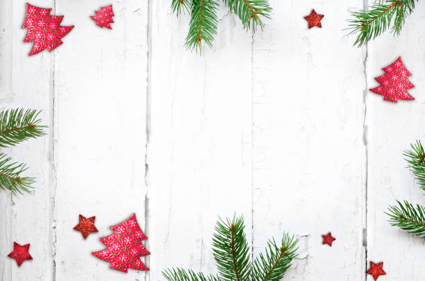 istock Fir branch with Christmas decorations on old wooden shabby background with copy space for text. 1161743922