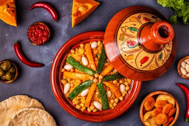 Vegetable tagine with almond and chickpea couscous, top view.