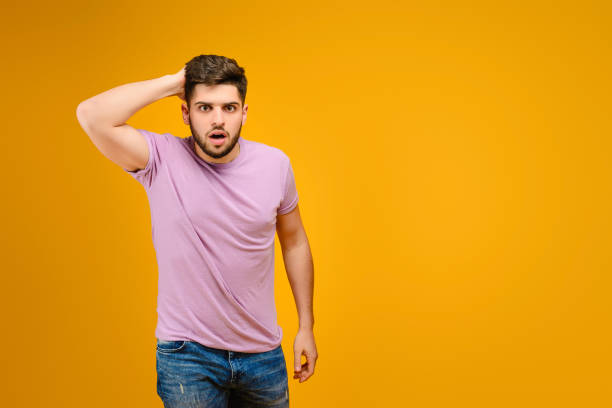 istock Young man isolated over bright yellow background 1161749262