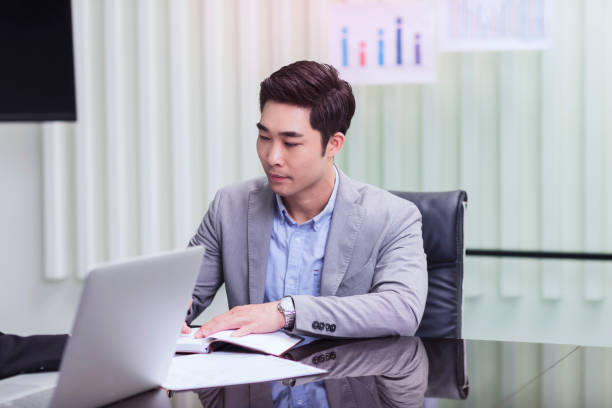 istock Confident mature businessman in office 1161750033