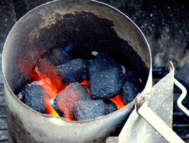 istock Coal briquettes burning in chimney starter 1161750568