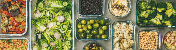 istock Various healthy vegan or vegetarian dishes in containers, wide composition 1161750646