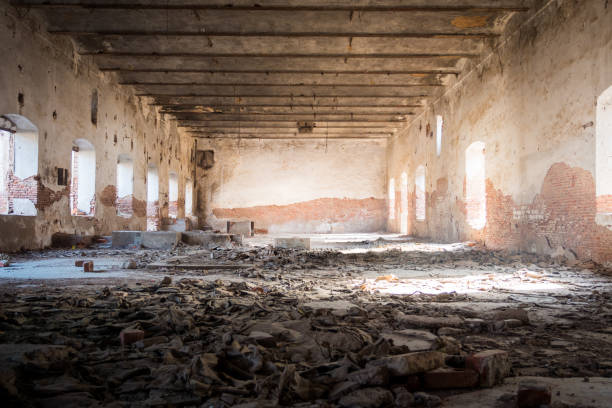 istock Abandoned and run down warehouse space, old factory, centred, low angle 1161751669