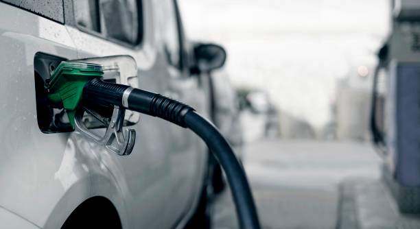 Pumping gasoline fuel in car. Pumping gasoline fuel in car. refueling stock pictures, royalty-free photos & images