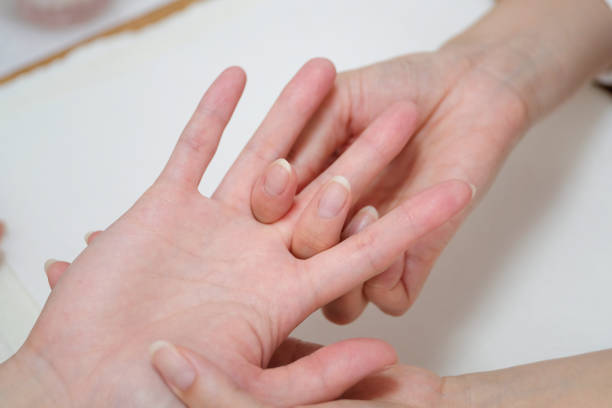istock Nail stylist massaging client's hands 1161752626