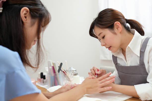 istock Nail stylist paintings fingernails 1161752859