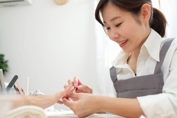 istock Nail stylist paintings fingernails 1161752905