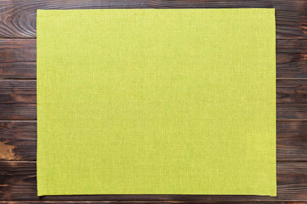 istock green cloth napkin on dark rustic wooden background top view with copy space 1161754024