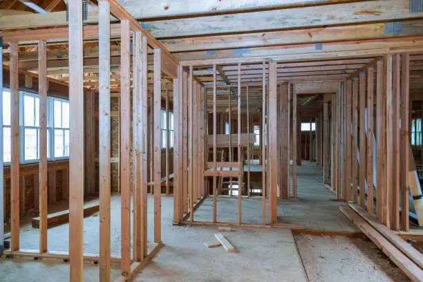 Interior view of a house under construction home framing