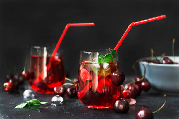 istock lemonade with cherries in a glass on a black background 1161754648