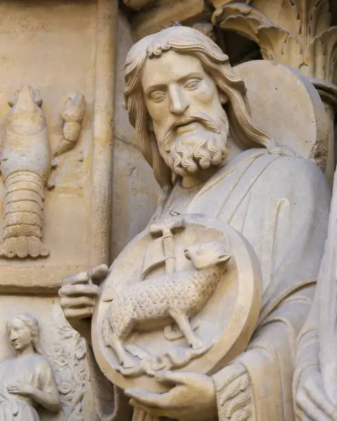 Medieval Statue of Saint John the Baptist at the Cathedral of Notre Dame, Paris, France.