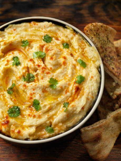 istock Roasted Garlic Hummus with Herb Pita Chips 1161758149