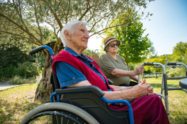 istock Senior Women Relaxing Outdoors in Public Park 1161759049