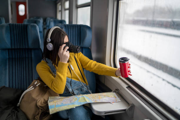 istock Young woman traveling by train 1161760120