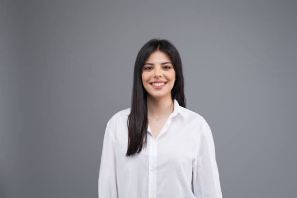 istock Attractive young brunette woman isolated on grey background 1161760352