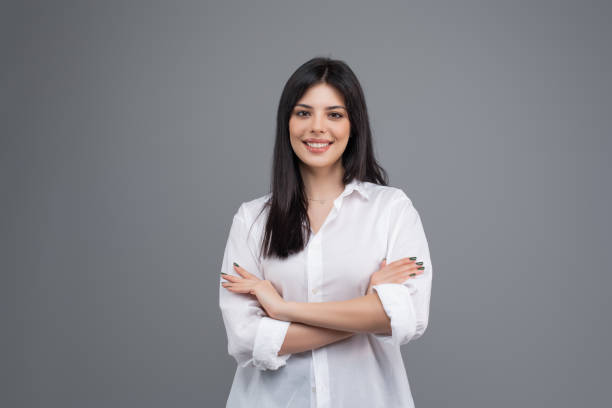 istock Attractive young brunette woman isolated on grey background 1161760494