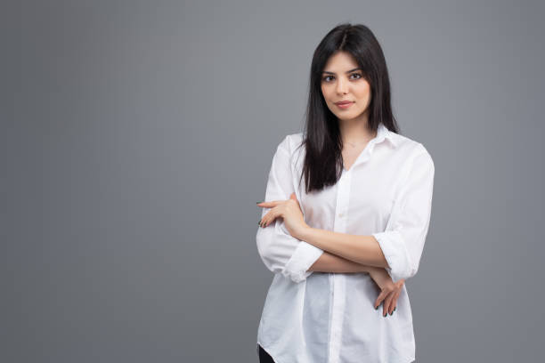 istock Attractive young brunette woman isolated on grey background 1161760509