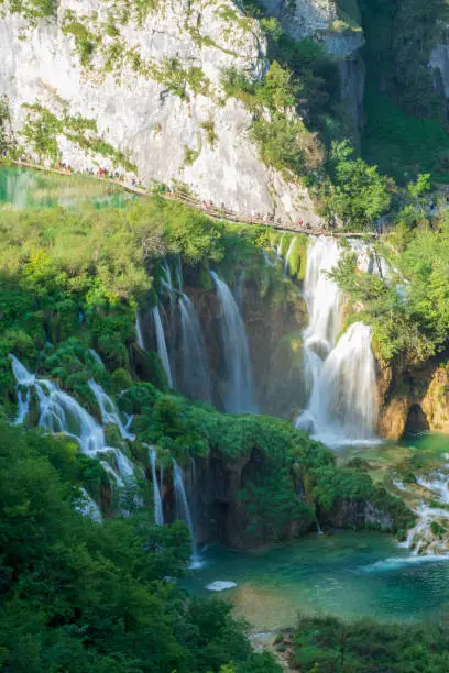 Photo of Pure, fresh water cascading down the rock face underneath the Veliki Slap, the Great Waterfall, at the Plitvice Lakes National Park in Croatia