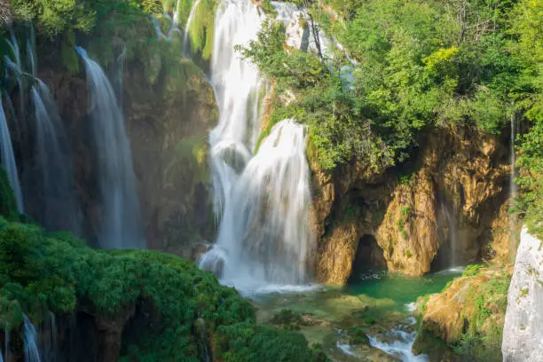 Photo of Pure, fresh water cascading down the rock face underneath the Veliki Slap, the Great Waterfall, at the Plitvice Lakes National Park in Croatia