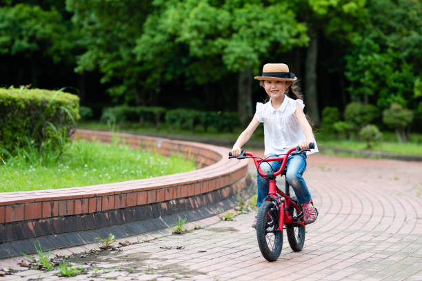 istock Girl riding a bicycle 1161760637
