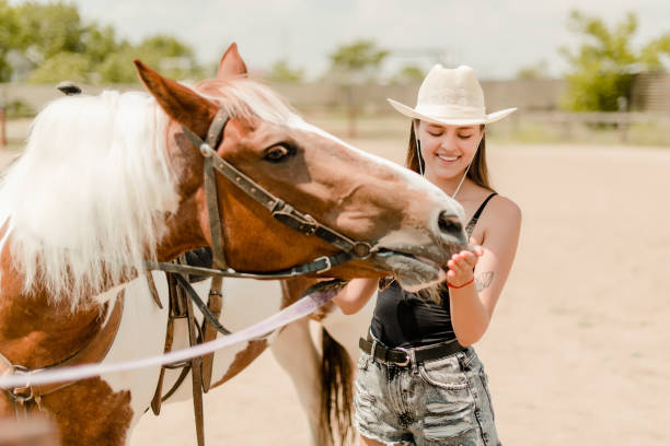 istock Woman and horse 1161762473