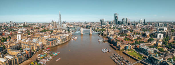 Arial view of London with the River Thames Arial view of London with the River Thames near Tower Bridge, the Shard and Canary Wharf district at sunrise. big ben stock pictures, royalty-free photos & images