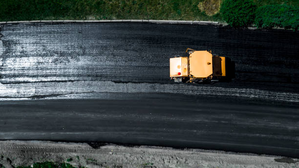 istock Aerial view on the new asphalt road under construction 1161764410