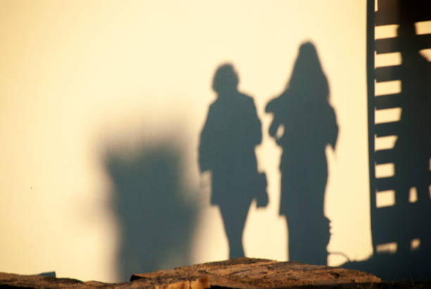 istock Shadow of people on wall 1161765223