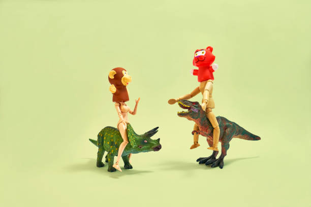 istock It is a play of humans who wrote animals masked on small dinosaurs. 1161765276