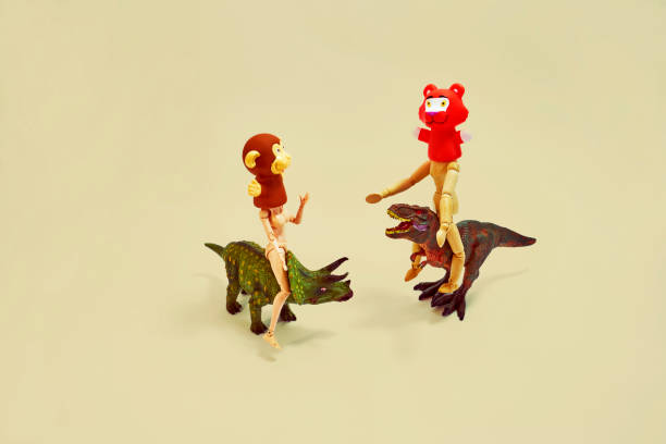 istock It is a play of humans who wrote animals masked on small dinosaurs. 1161765335