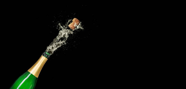 Champagne bottle on a black background with copy space