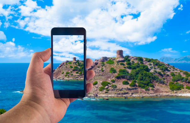 istock Hand taking picture with smartphone in a sunny day 1161767754