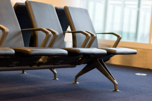 istock Black chairs in airport waiting room. 1161768242