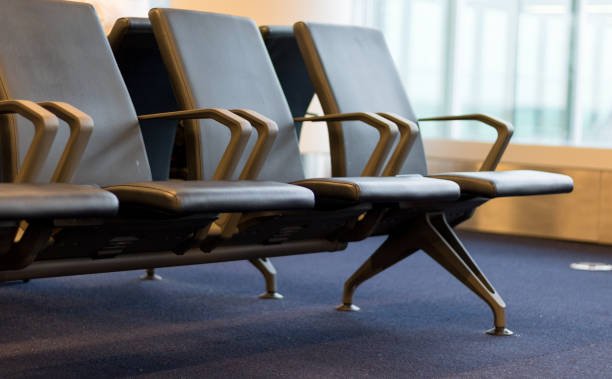 istock Black chairs in airport waiting room. 1161768250