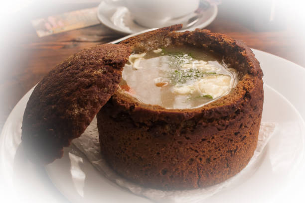 istock Soup in bread bowl on white plate 1161768266