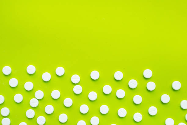 istock Tablets of Paracetamol on green background. 1161768300