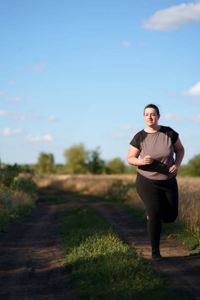 istock Overweight runner go jogging outdoors. Weight loss 1161768951