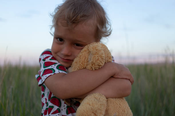 Boy with toy in nature