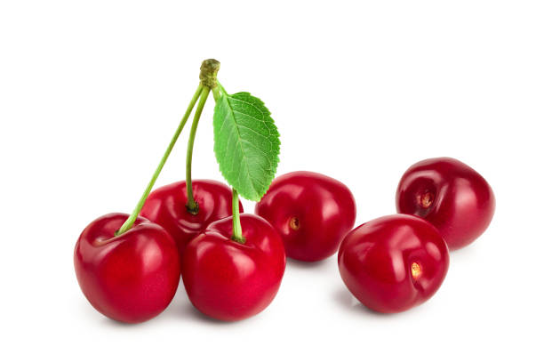 istock Sweet red cherries with leaves isolated on white background macro 1161770403