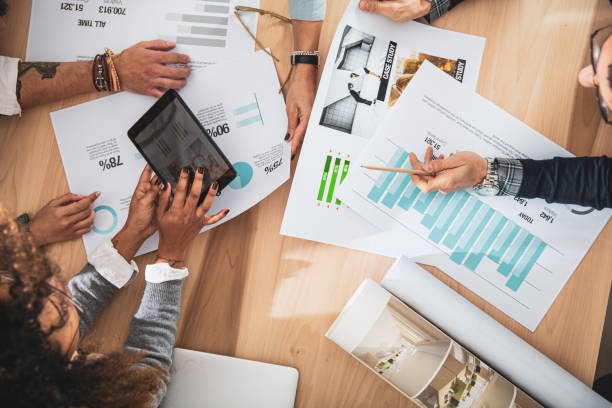 istock Stats checking at the office - Group of creatives working to new projects 1161773245