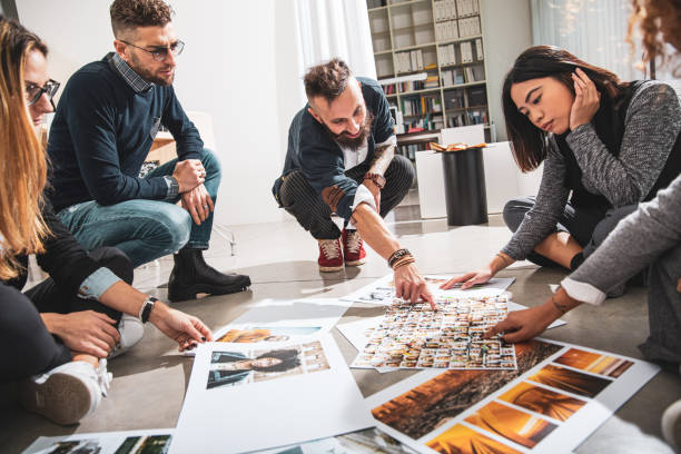 istock Office colleagues working and brainstorming as a Team choosing the project main image 1161773305